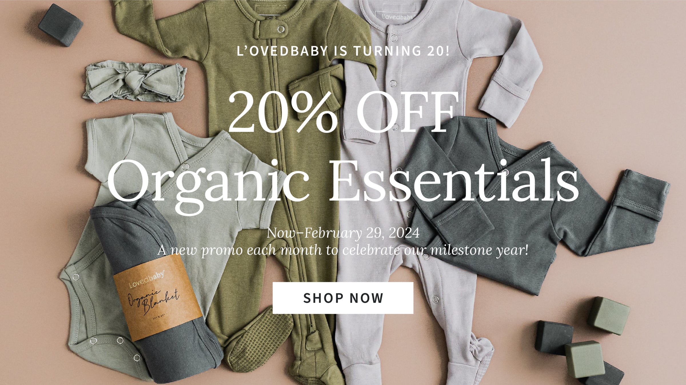 styled flat lay image of organic essentials items in gray and green color palette. overlaid white text says "L'ovedbaby is turning 20! 20% off organic essentials. now - February 29, 2024. a new promo each month to celebrate our milestone year!"