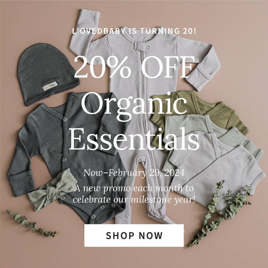 styled flat lay image of organic essentials items in gray and green color palette. overlaid white text says "L'ovedbaby is turning 20! 20% off organic essentials. now - February 29, 2024. a new promo each month to celebrate our milestone year!"