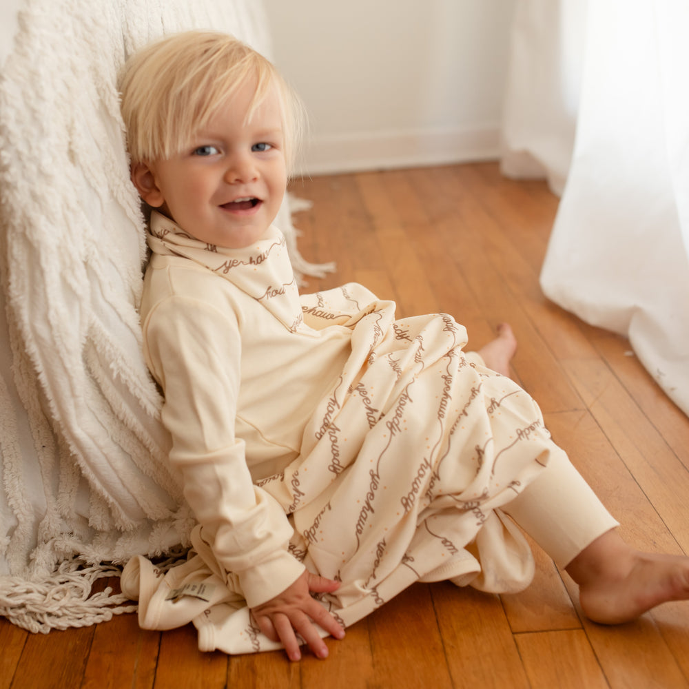 Child with Organic Blanket in Howdy