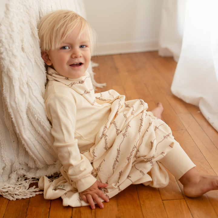 Child with Organic Blanket in Howdy