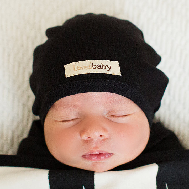 Child wearing Organic Cute Cap in Black.