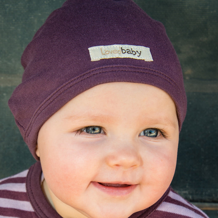 Child wearing Organic Cute Cap in Eggplant.