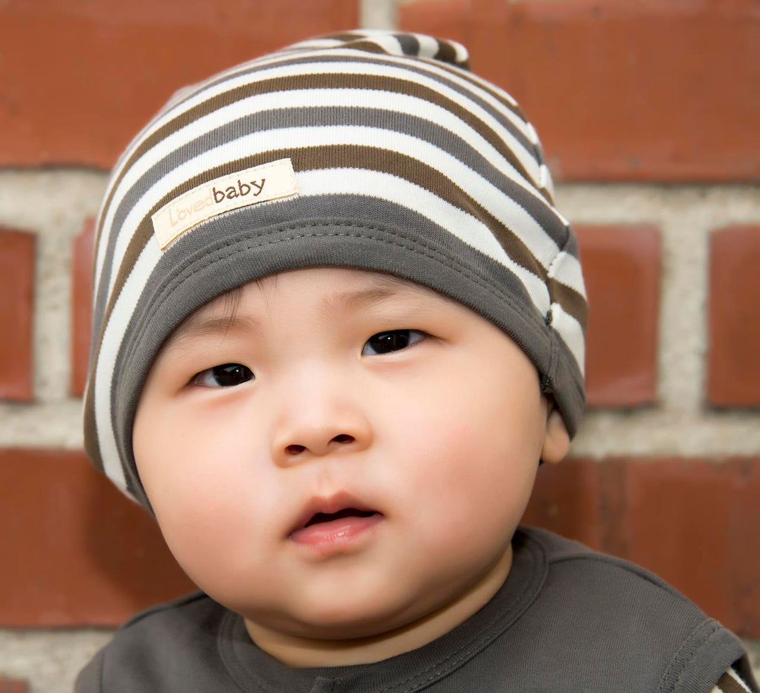 Child wearing Organic Cute Cap in Gray Stripe.
