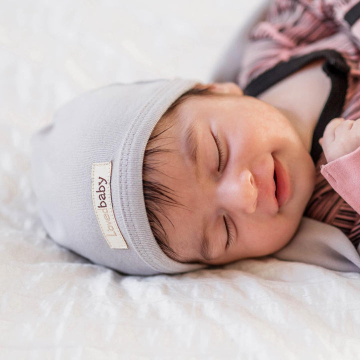 Child wearing Organic Cute Cap in Light Gray.