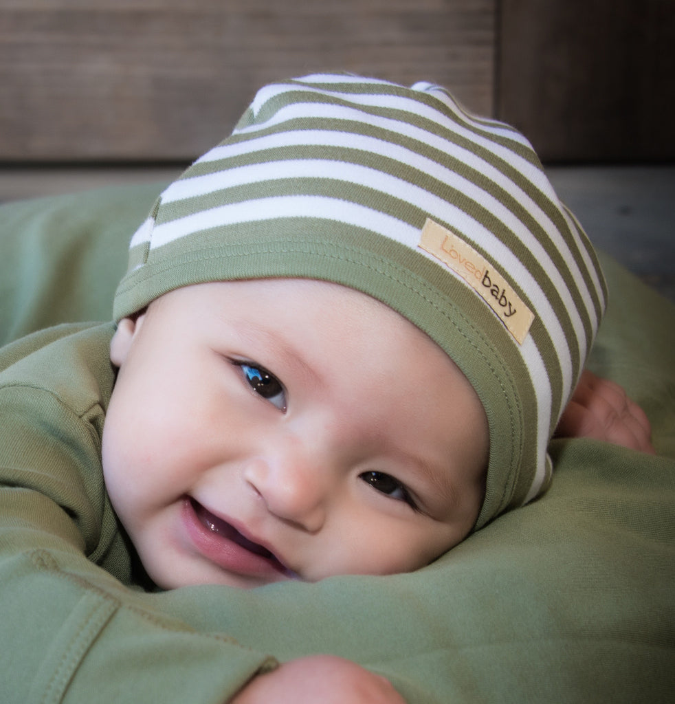 Child wearing Organic Cute Cap in Sage/White.