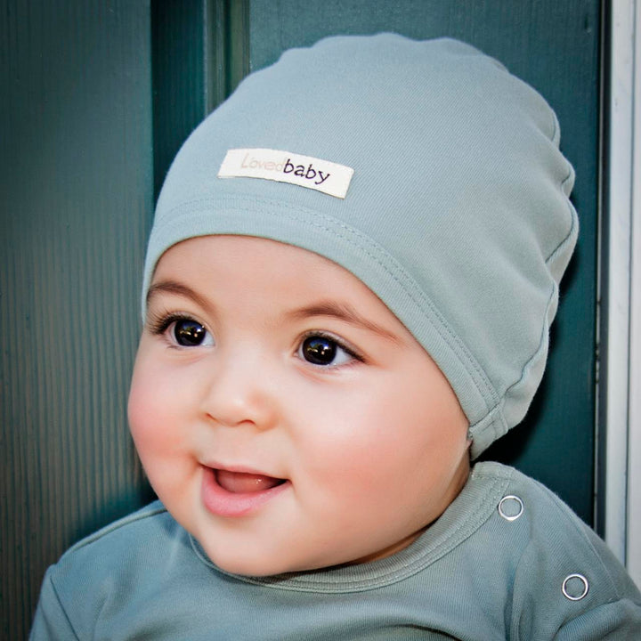 Child wearing Organic Cute Cap in Seafoam.