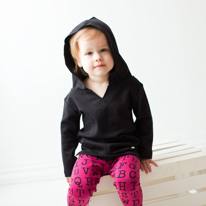Child wearing Organic Hoodie in Black.