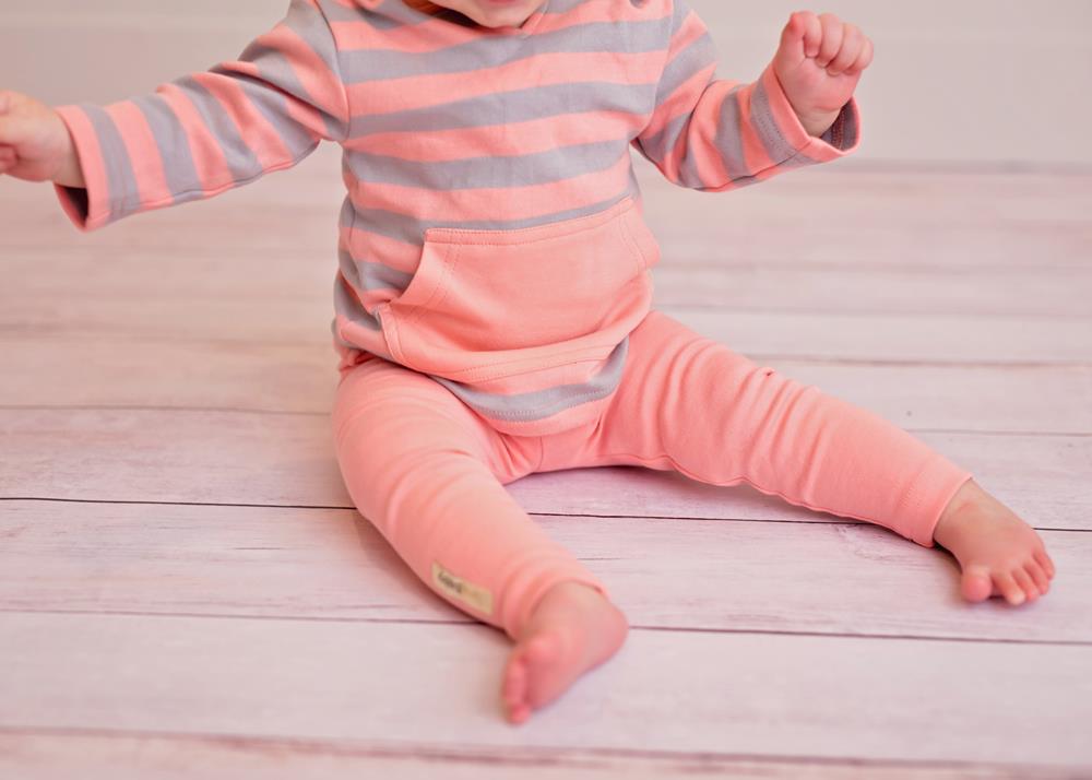 Child wearing Organic Hoodie in Coral/Light Gray Stripe.