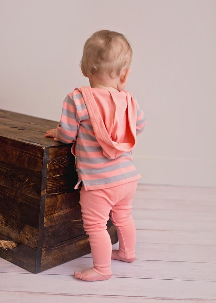 Child wearing Organic Hoodie in Coral/Light Gray Stripe.