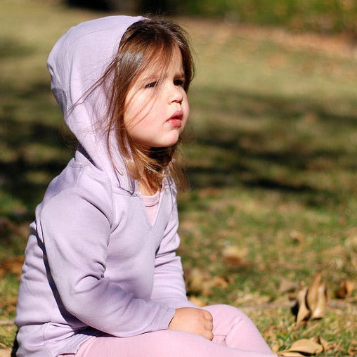 Child wearing Organic Hoodie in Lavender.