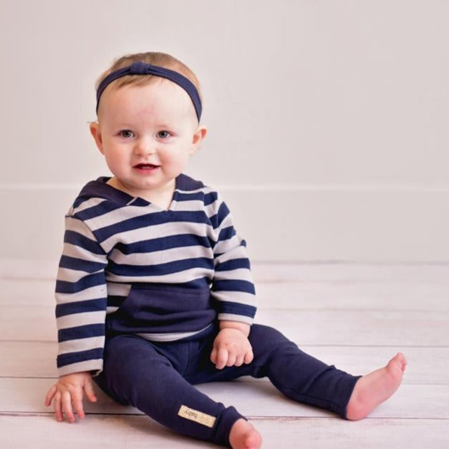 Child wearing Organic Hoodie in Navy/Light Gray Stripe.