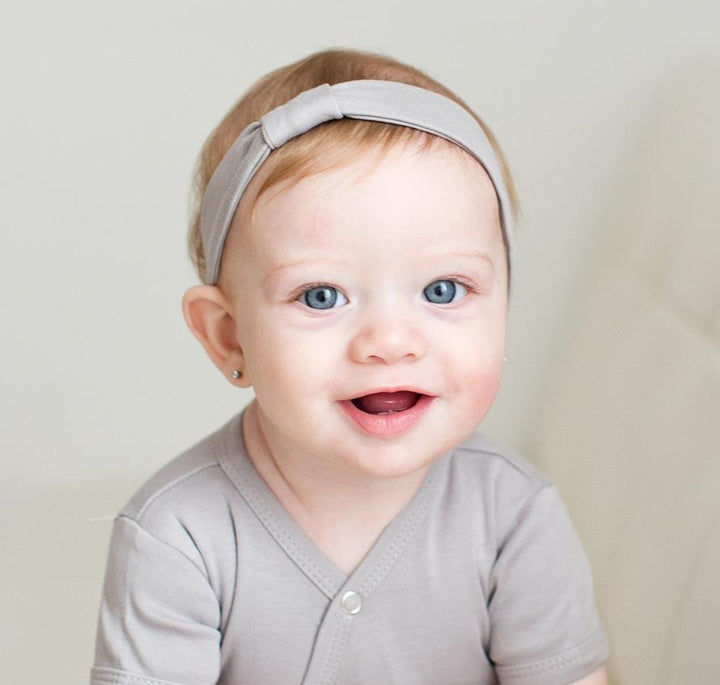 Child wearing Organic Headband in Light Gray.