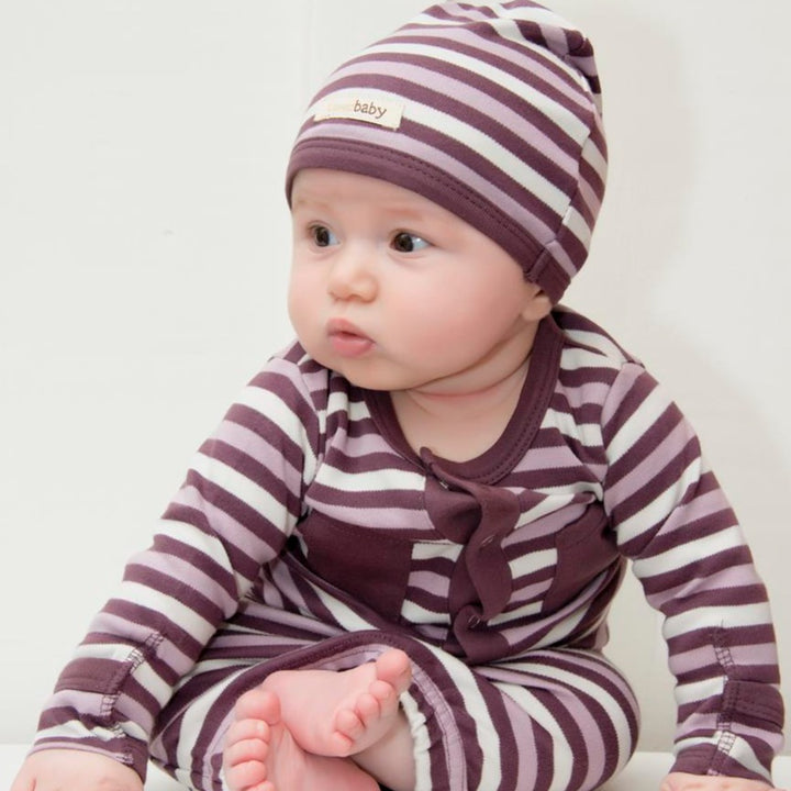 Child wearing Organic Gown in Eggplant Stripe.