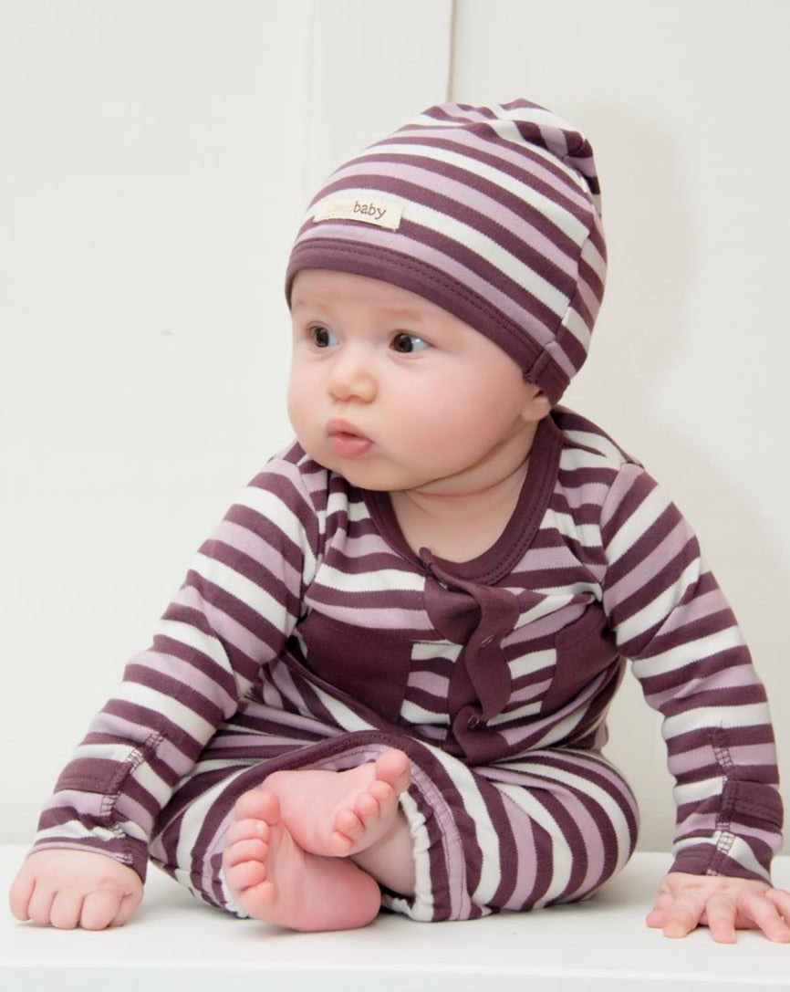 Child wearing Organic Gown in Eggplant Stripe.