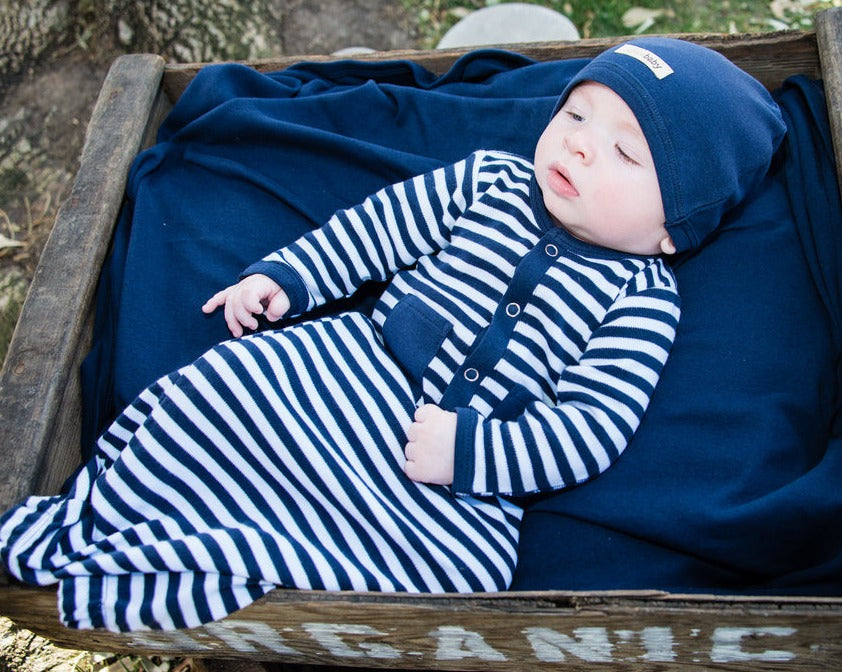 Child wearing Organic Gown in Navy/White.