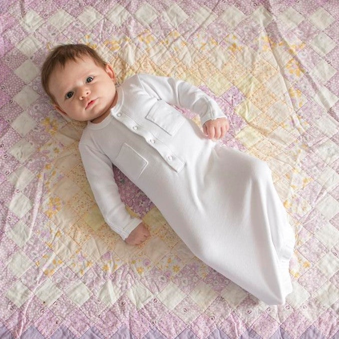 Child wearing Organic Gown in White.