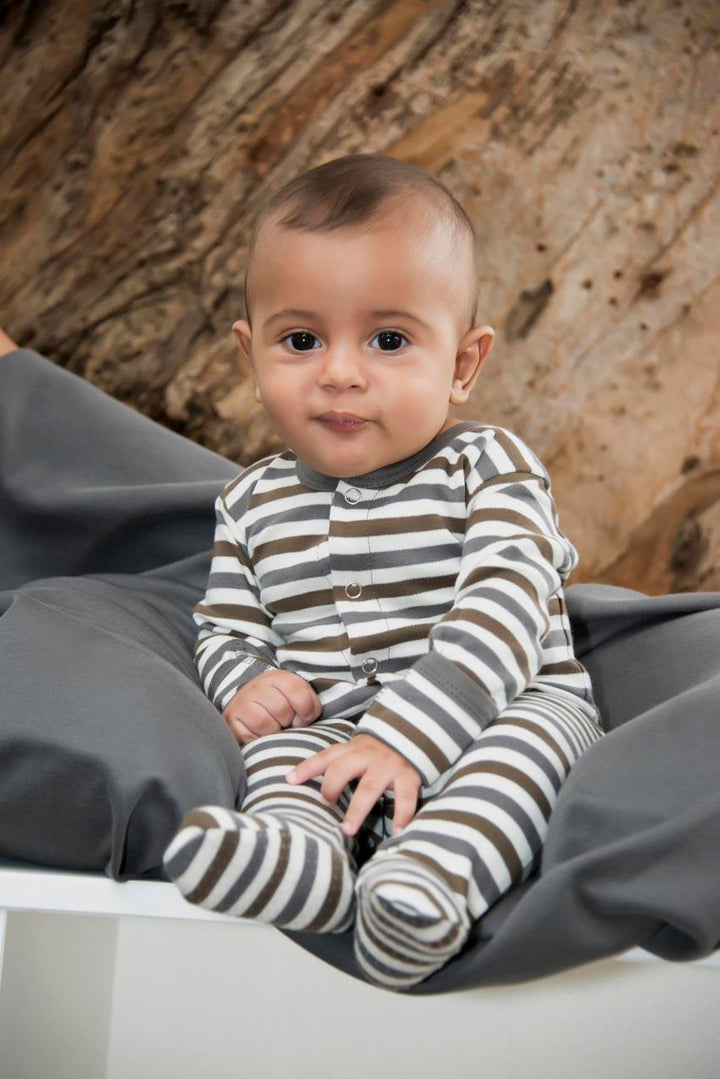 Child wearing Organic Snap Footie in Gray Stripe.