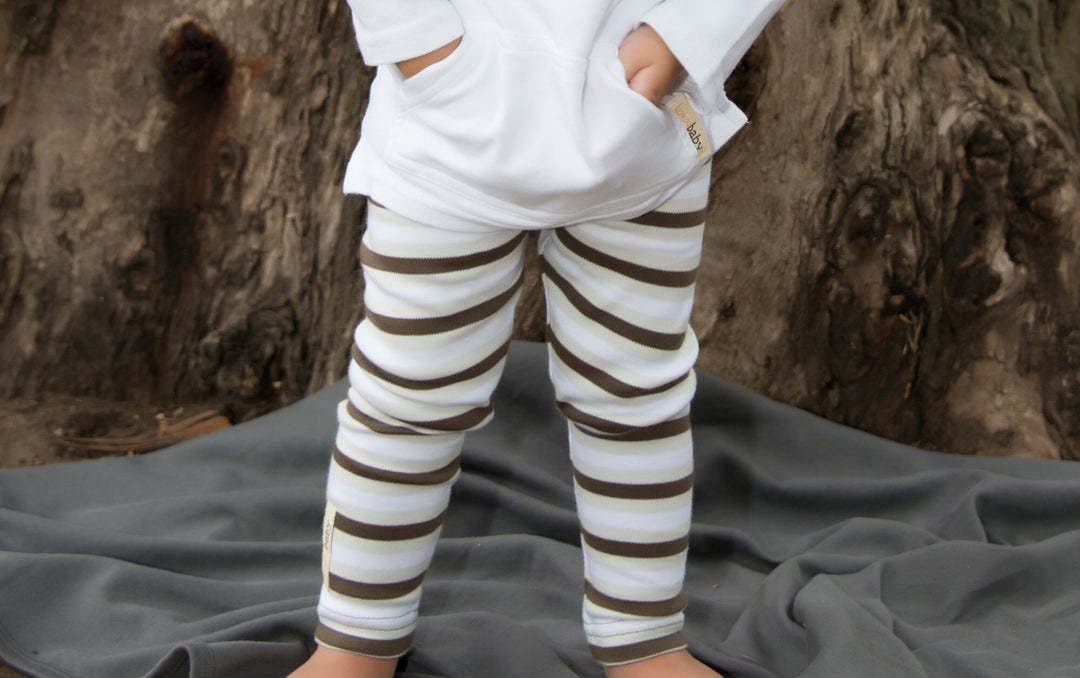 Child wearing Organic Leggings in Bark Stripe.