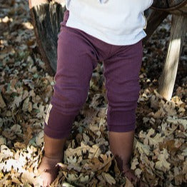 Child wearing Organic Leggings in Eggplant.