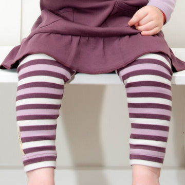 Child wearing Organic Leggings in Eggplant Stripe.