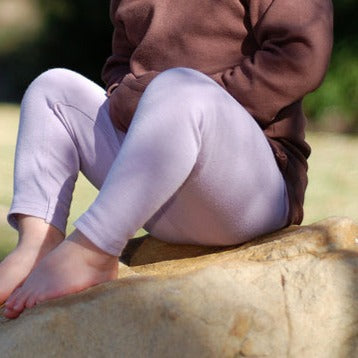 Child wearing Organic Leggings in Lavender.
