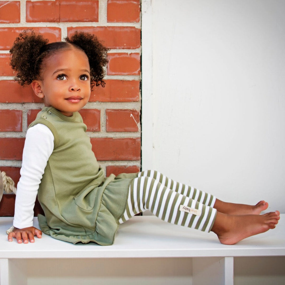 Child wearing Organic Leggings in Sage/White.