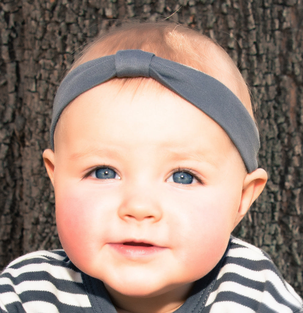 Child wearing Organic Headband in Gray.