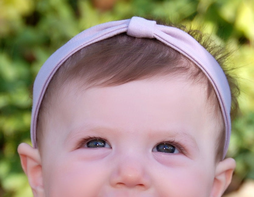Child wearing Organic Headband in Lavender.