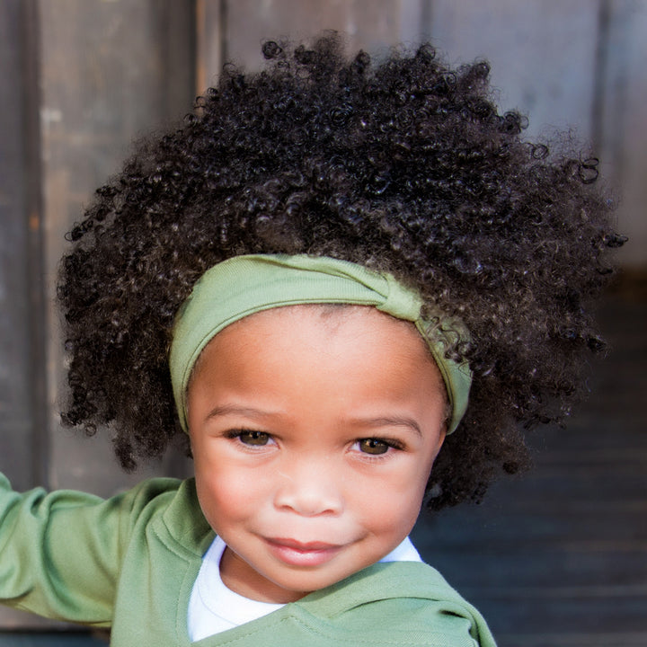 Child wearing Organic Headband in Sage.