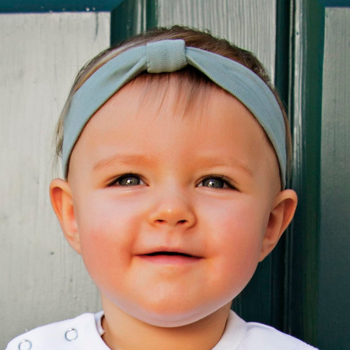Child wearing Organic Headband in Seafoam.