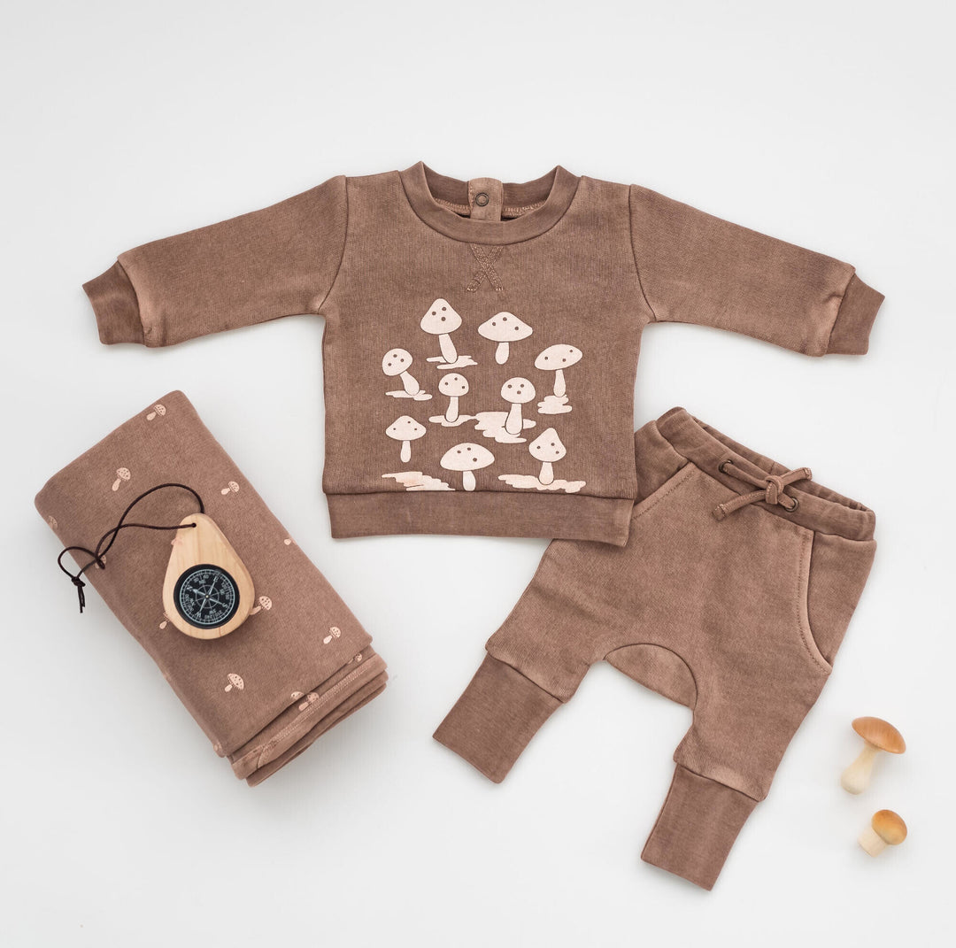 Child wearing Organic Cozy Graphic Sweatshirt & Jogger Set in Umber Mushroom.