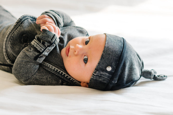 Child wearing Faux Denim Top-Knot Hat in Black.