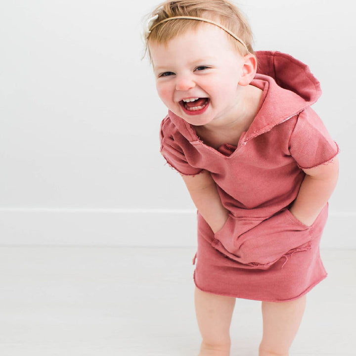 Child wearing Kids' French Terry Hoodie Dress in Sienna.