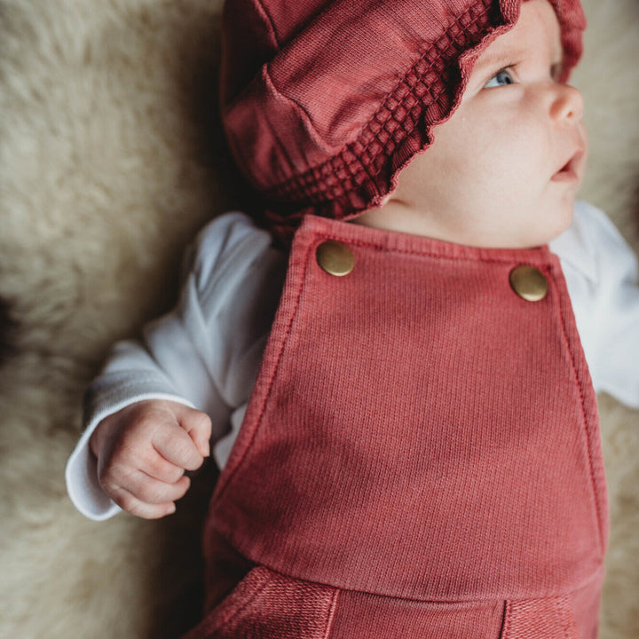 Child wearing French Terry Knotted Turban in Appleberry.