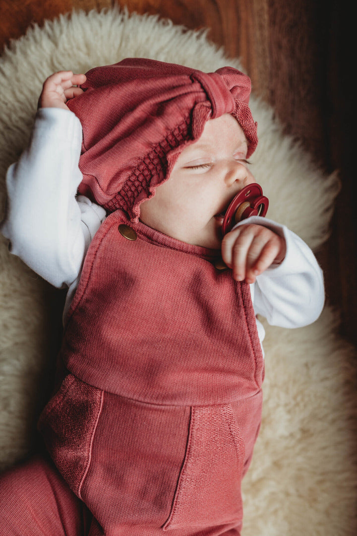 Child wearing French Terry Knotted Turban in Appleberry.
