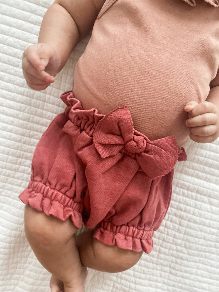 Child wearing French Terry Ruffle Bloomer in Sienna.