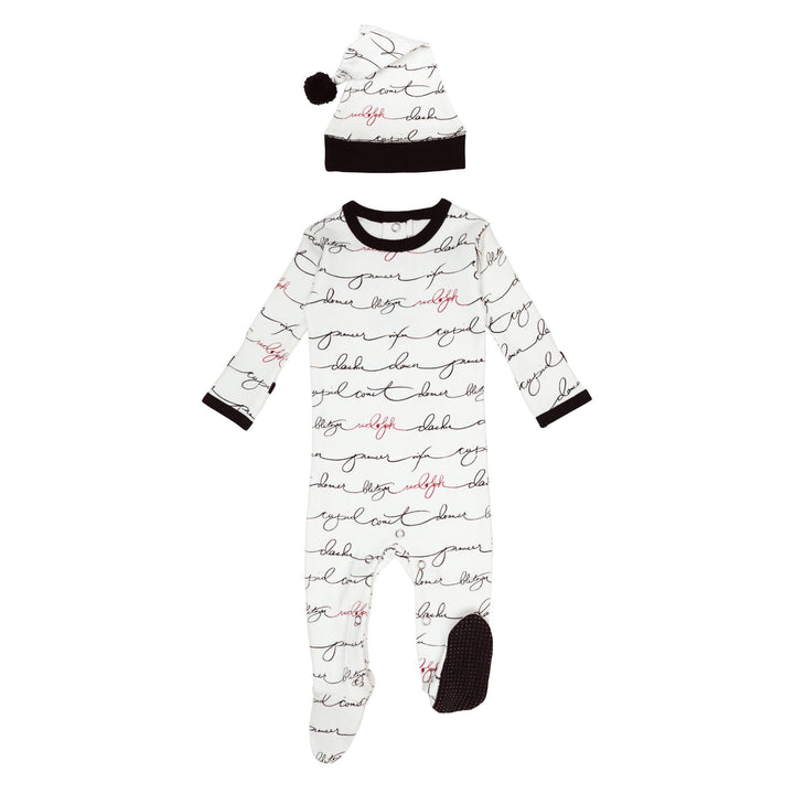 Organic Holiday Footie & Cap Set in Writing Reindeer, a white fabric with black printed reindeer names, and Rudolph's name in red.