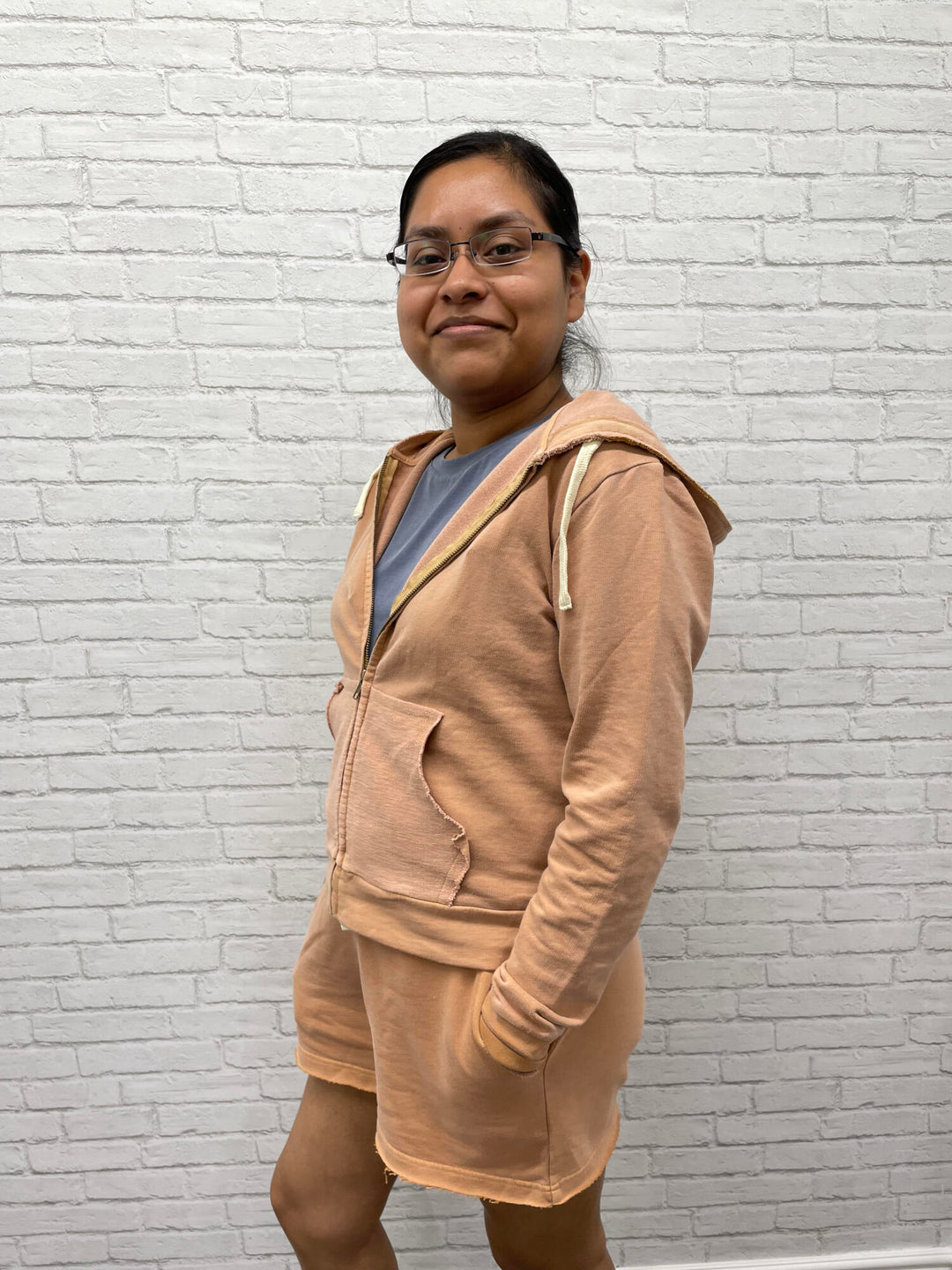 Woman wearing Women's French Terry Shorts and Jacket in Adobe.