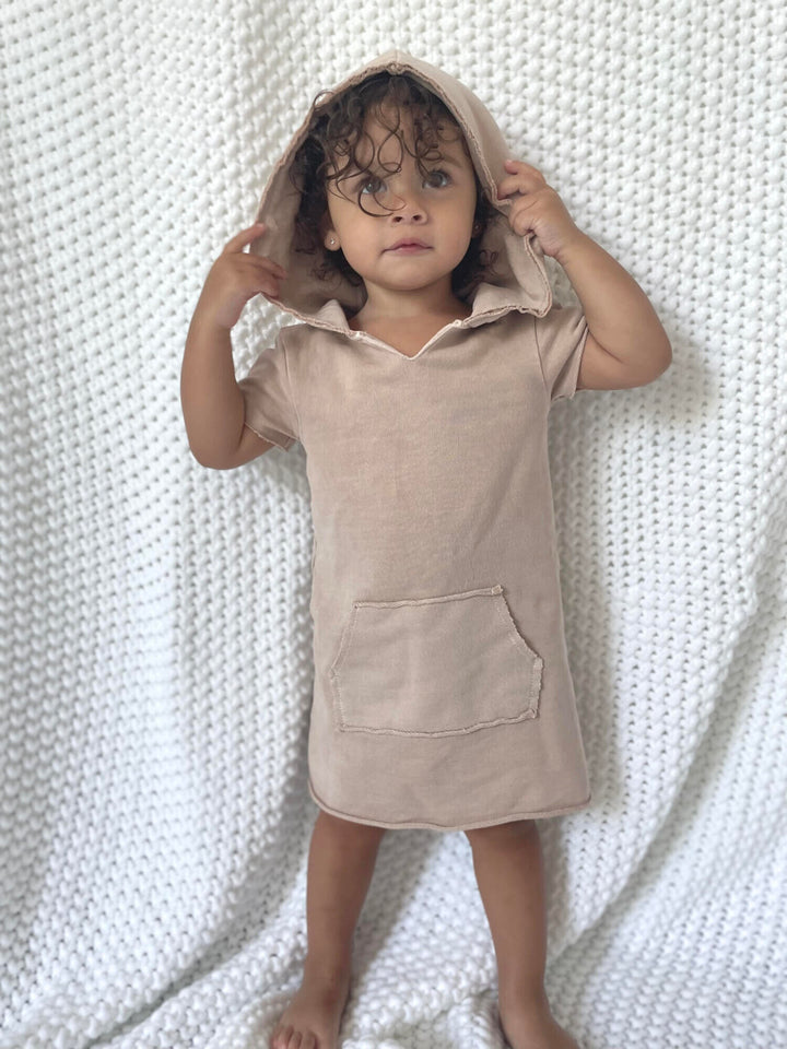 Child wearing Kids' French Terry Hoodie Dress in Oatmeal.