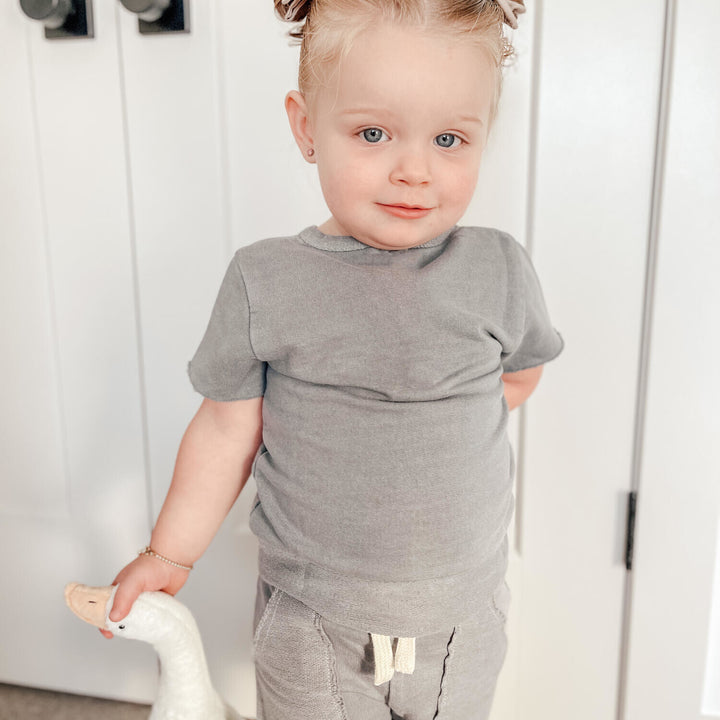 Child wearing Kids' French Terry Shorts & Tee Set in Mist.