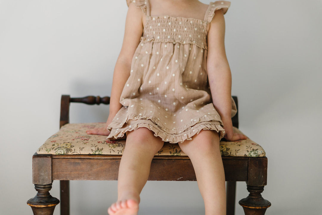 Child wearing Kids' Embroidered Muslin Summer Dress in Wheat Dot.