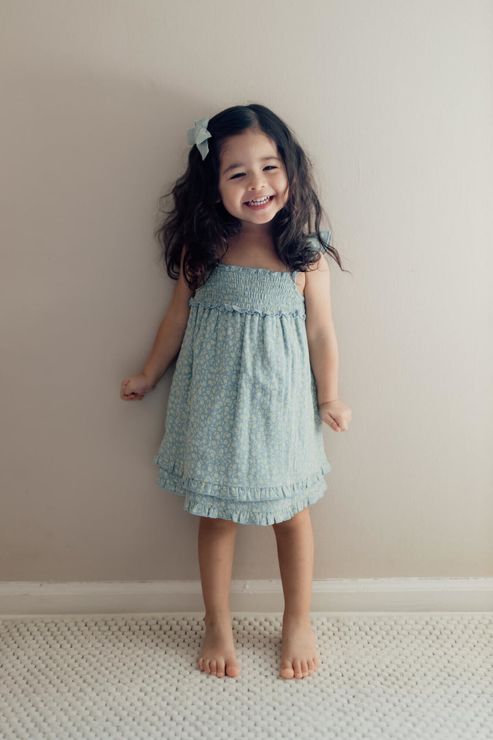Child wearing Kids' Printed Muslin Summer Dress in Lagoon Floral.