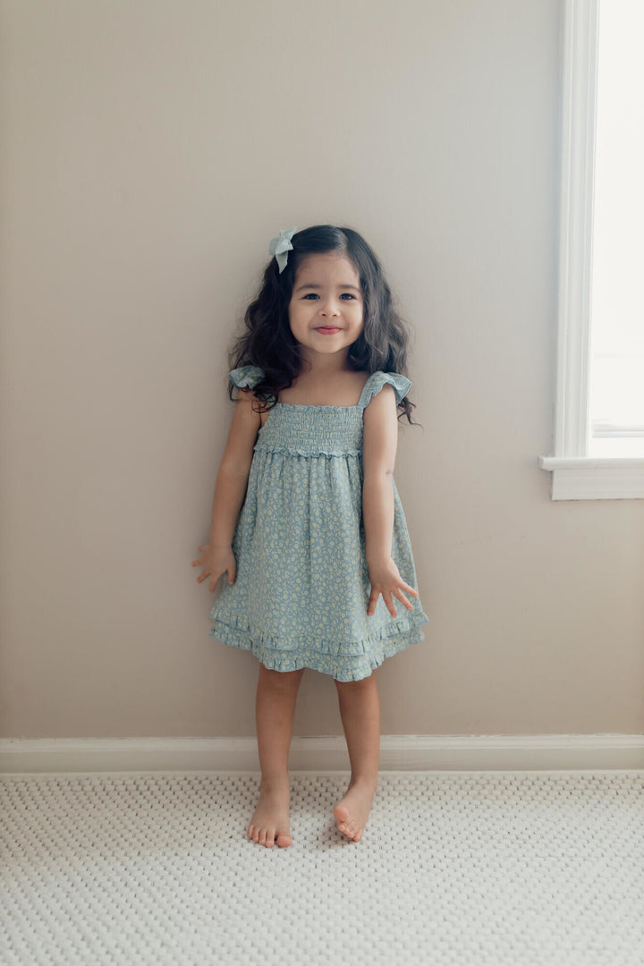 Child wearing Kids' Printed Muslin Summer Dress in Lagoon Floral.