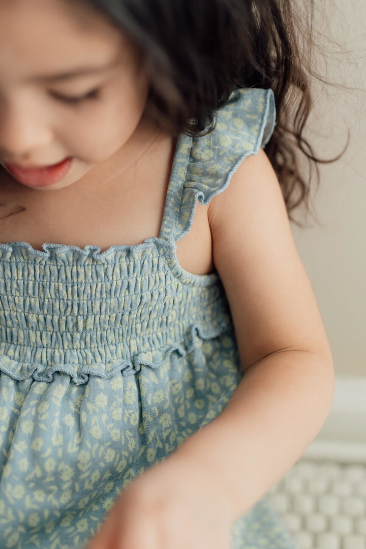 Child wearing Kids' Printed Muslin Summer Dress in Lagoon Floral.