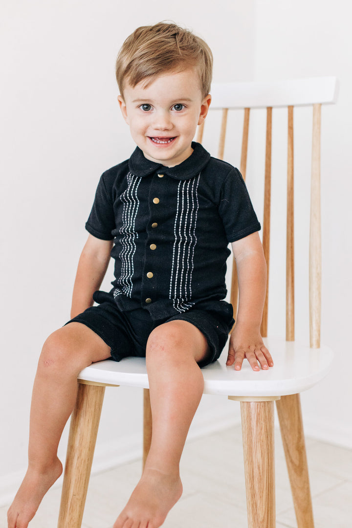 Child wearing Kids' Embroidered Shirt & Shorts Set in Black Dash.