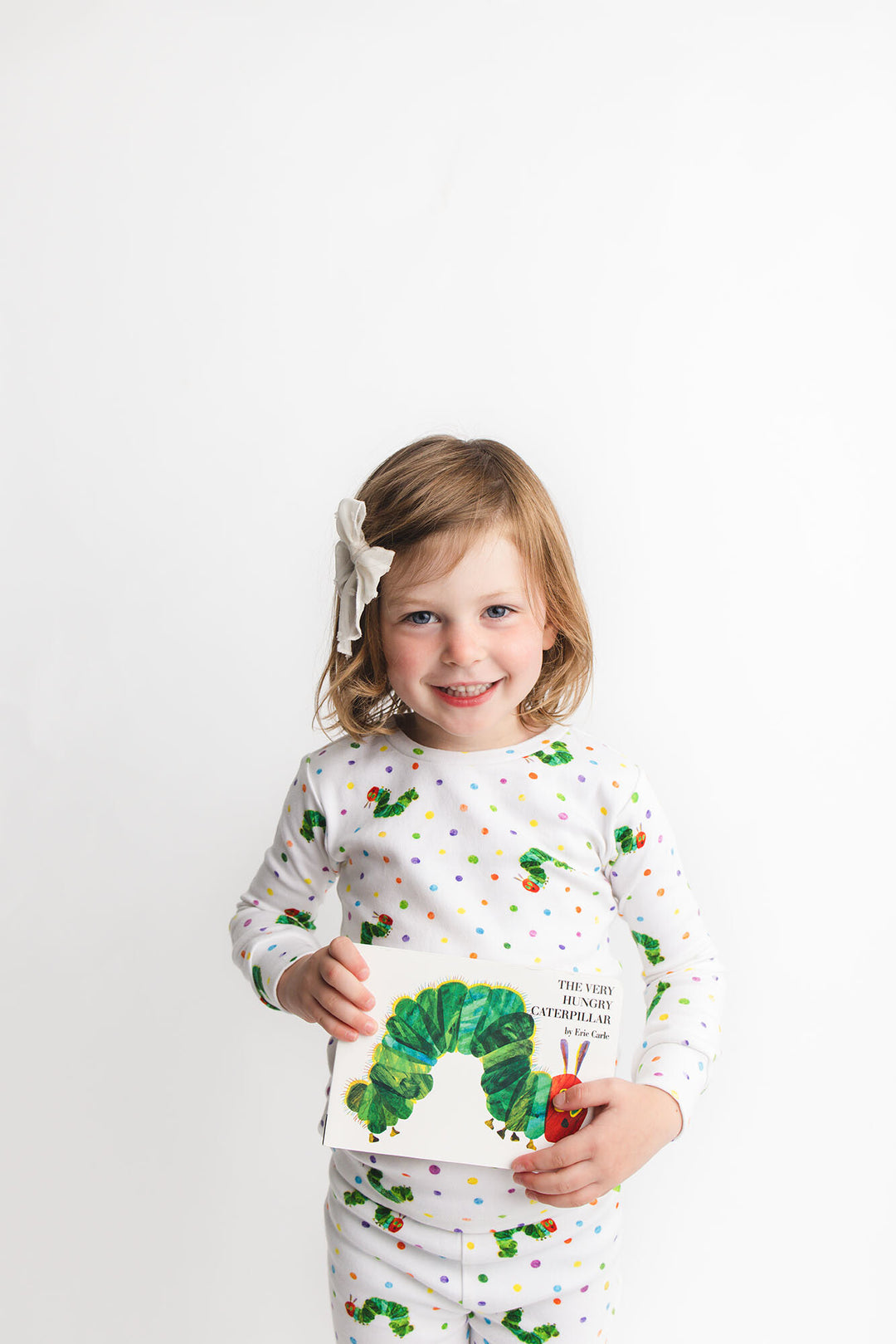 Child wearing Kids' Organic L/Sleeve PJ Set in Caterpillar.