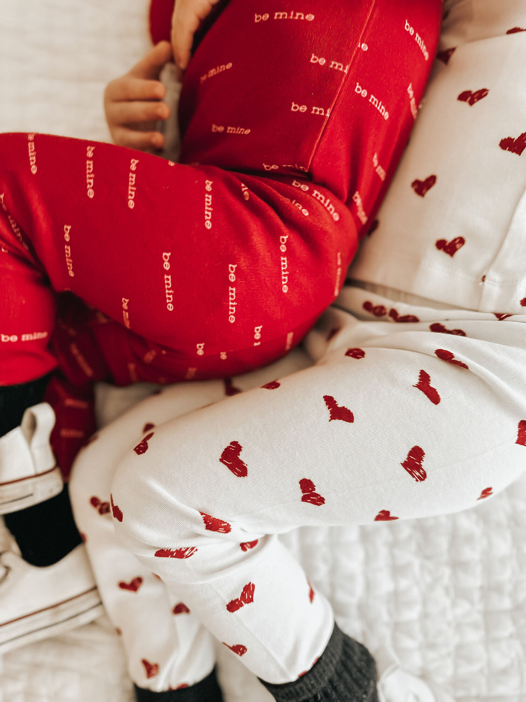 Child wearing Kids' Organic L/Sleeve PJ Set in Crimson Hearts.