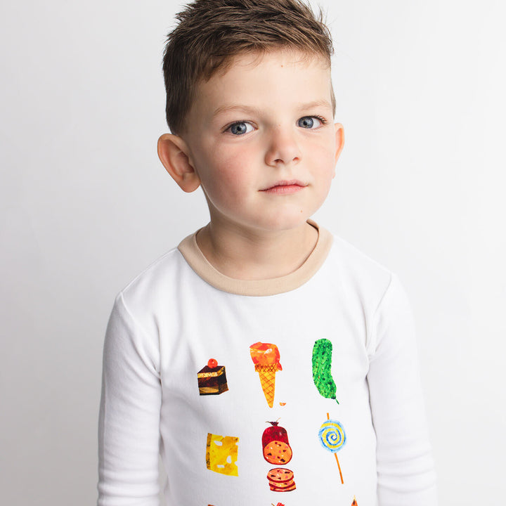 Child wearing Kids' Organic L/Sleeve PJ Set in Happy Day.