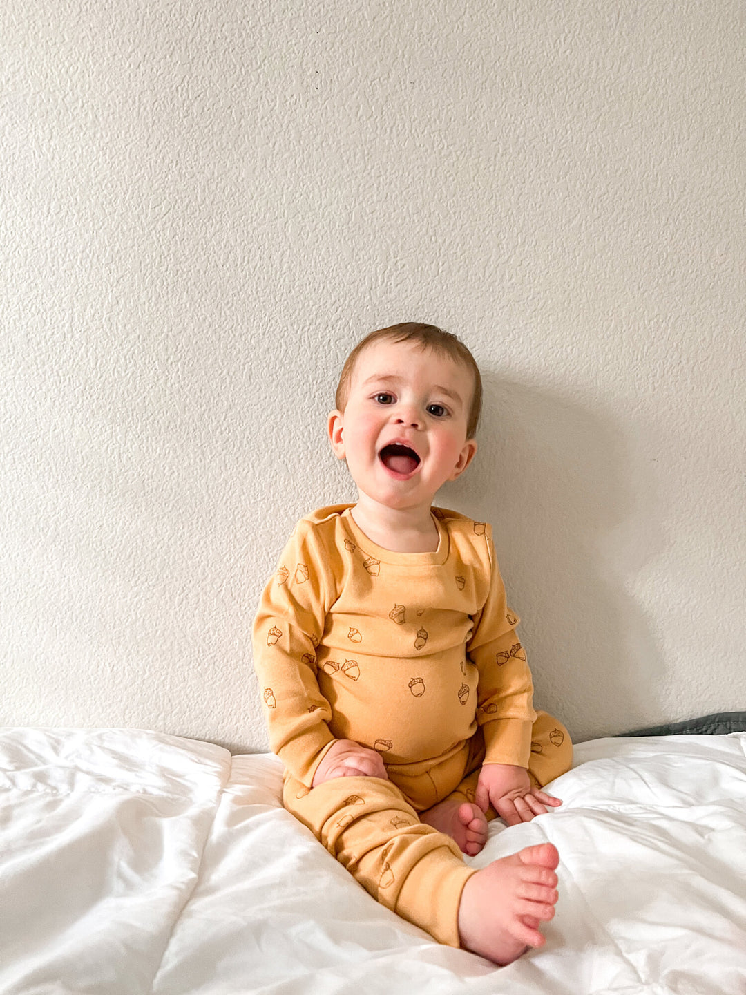 Child wearing Kids' Printed L/Sleeve PJ Set in Honey Acorn.