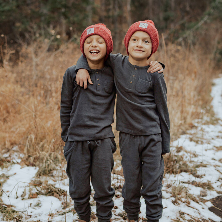 Child wearing Kids' Organic  Thermal Henley & Jogger Set in Coal.